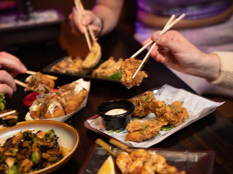 Chopsticks picking up food