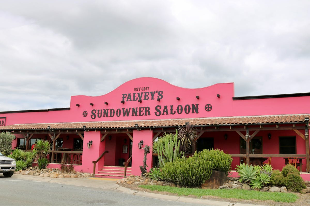 Pink Saloon with plants out the front