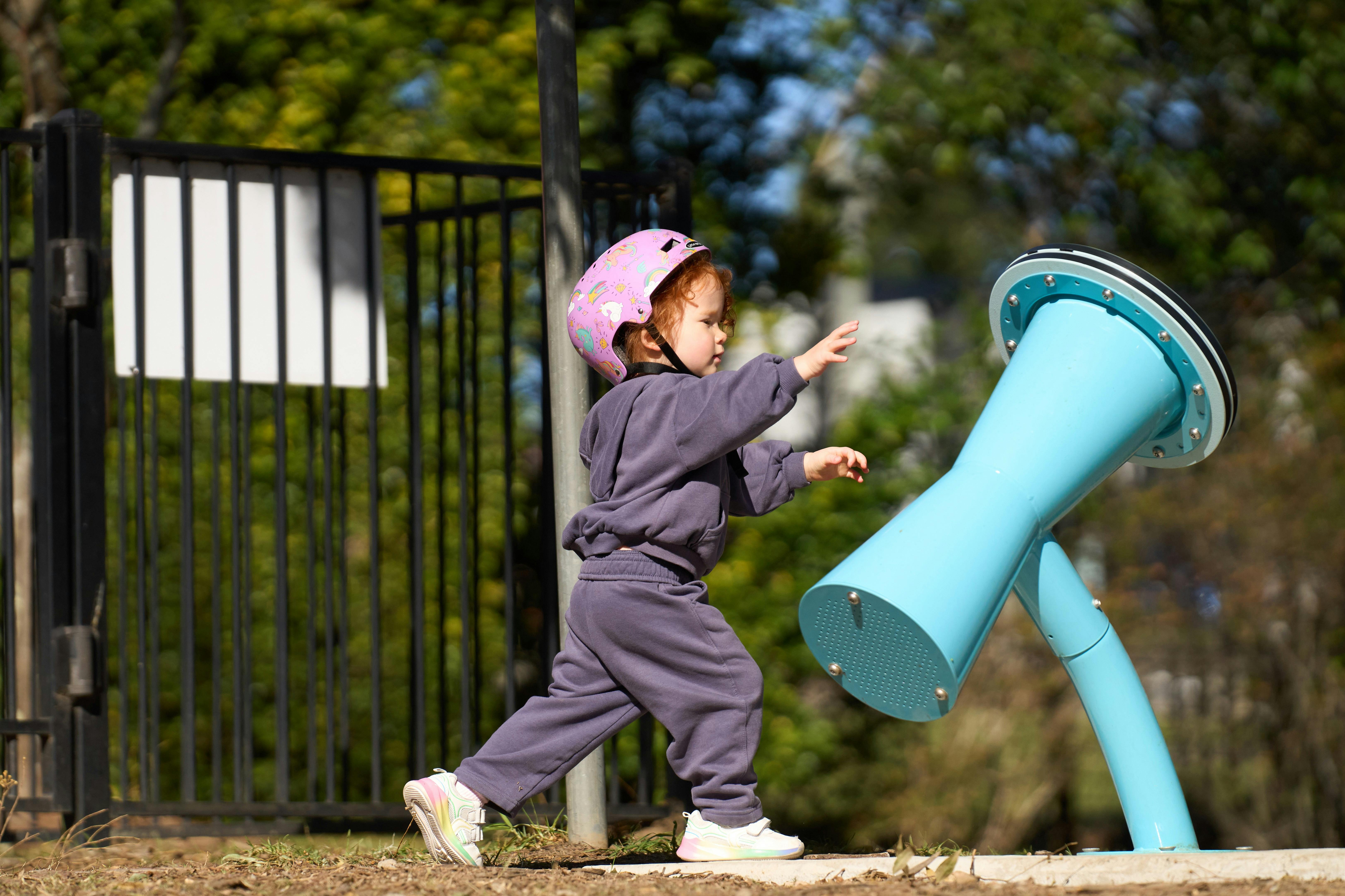 Young child playing instrument
