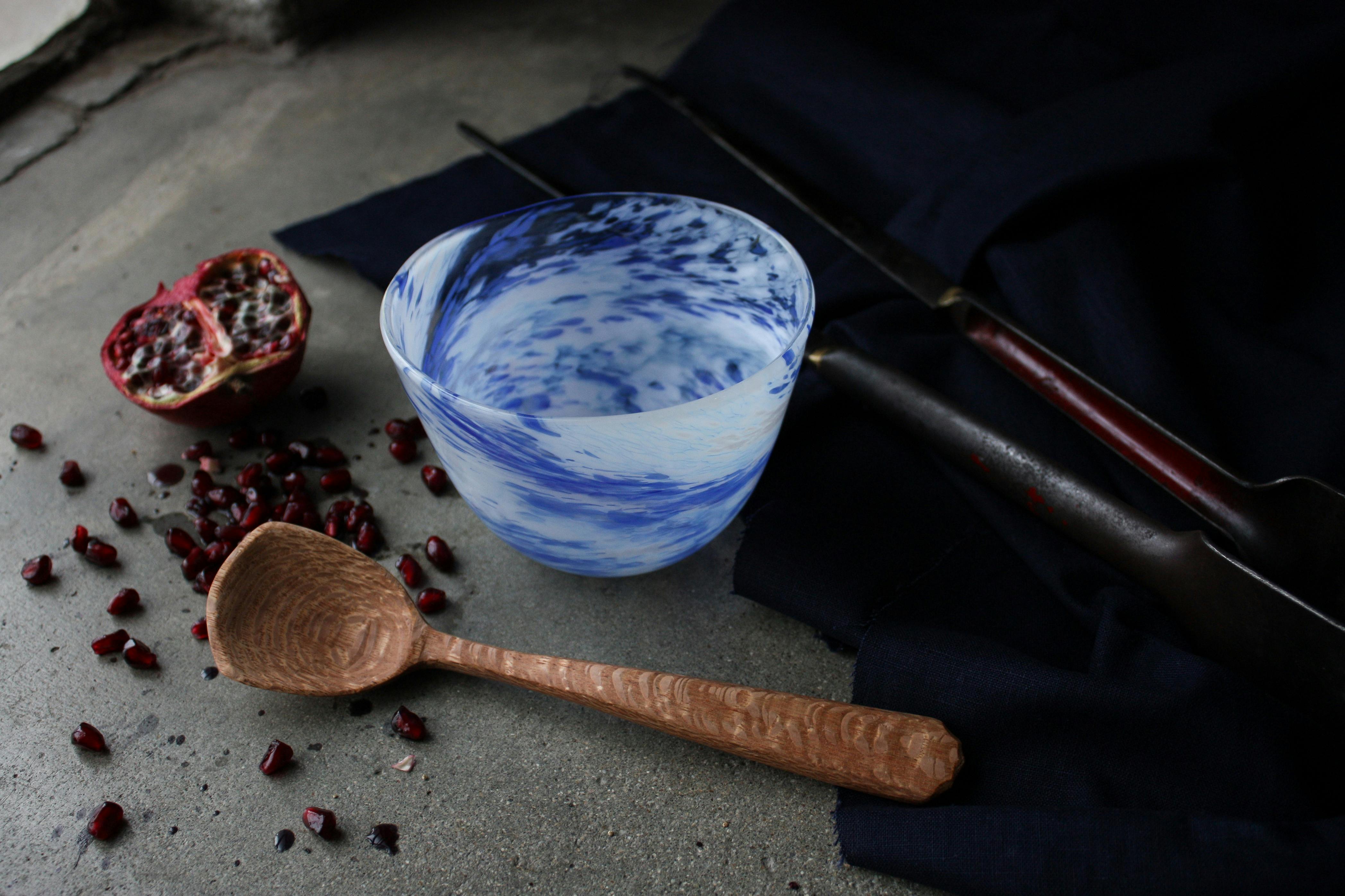 hand carved wooden spoon, and blown bowl