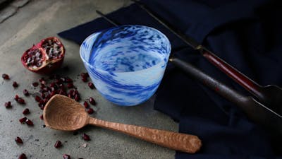 hand carved wooden spoon, and blown bowl