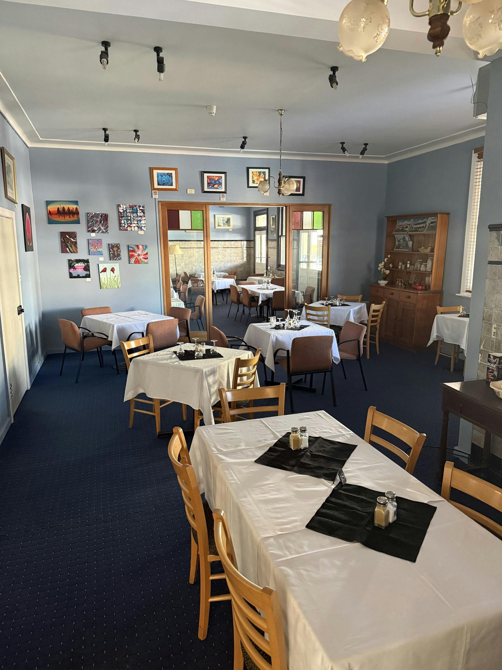 Dining room with tables set for guests at The Old Vic Canowindra
