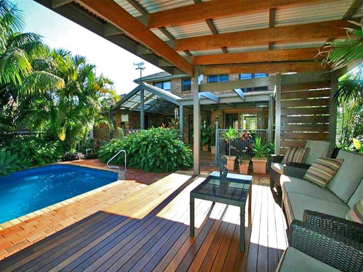 Outdoor lounge area with pool