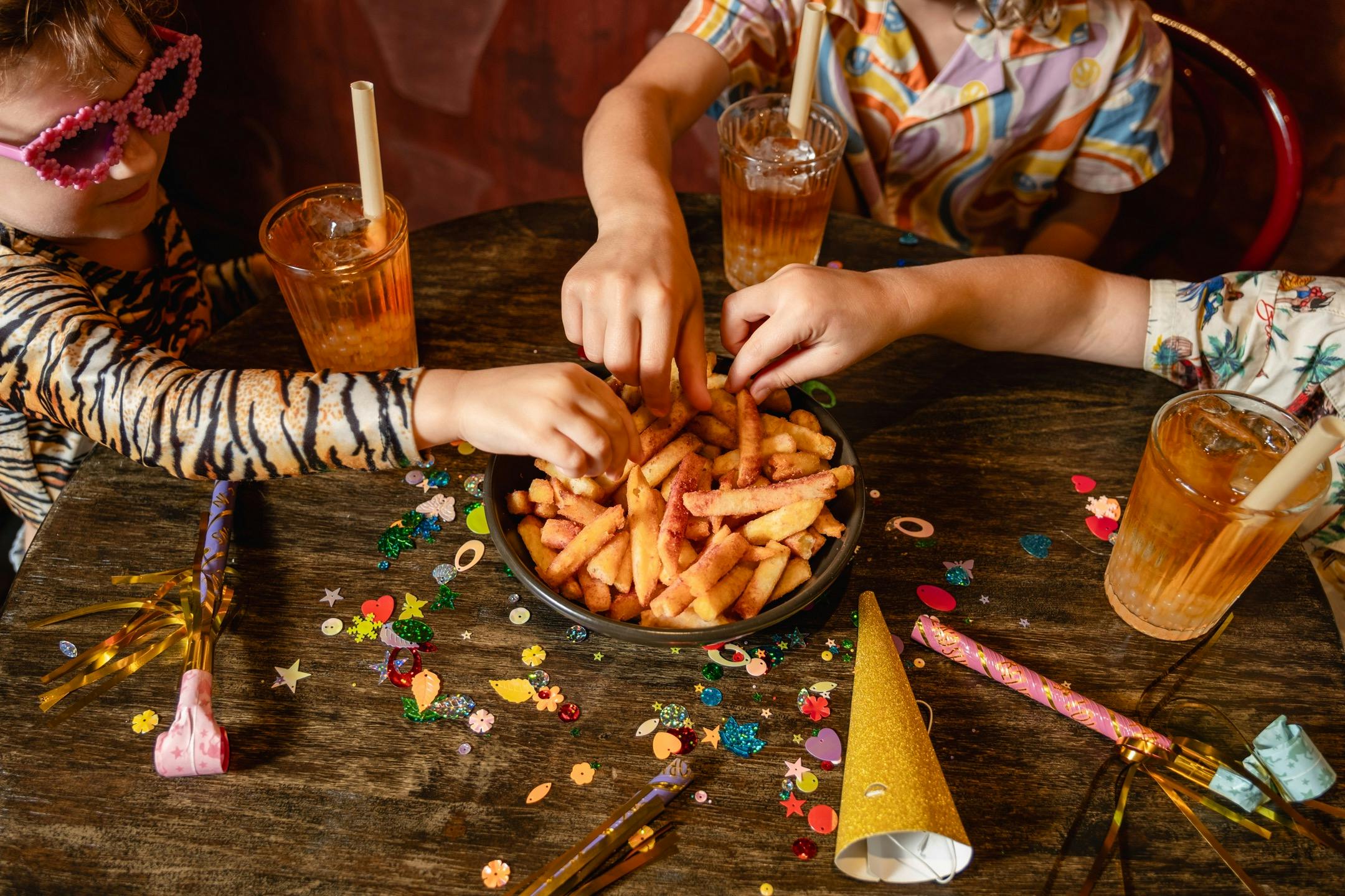 Children eating hot chips