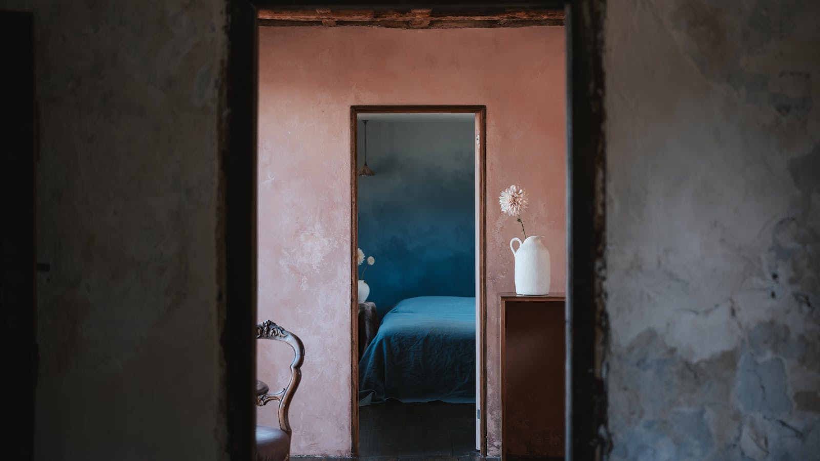 Textured walls and thoughtful colour schemes pay homage to the buildings history and surroundings