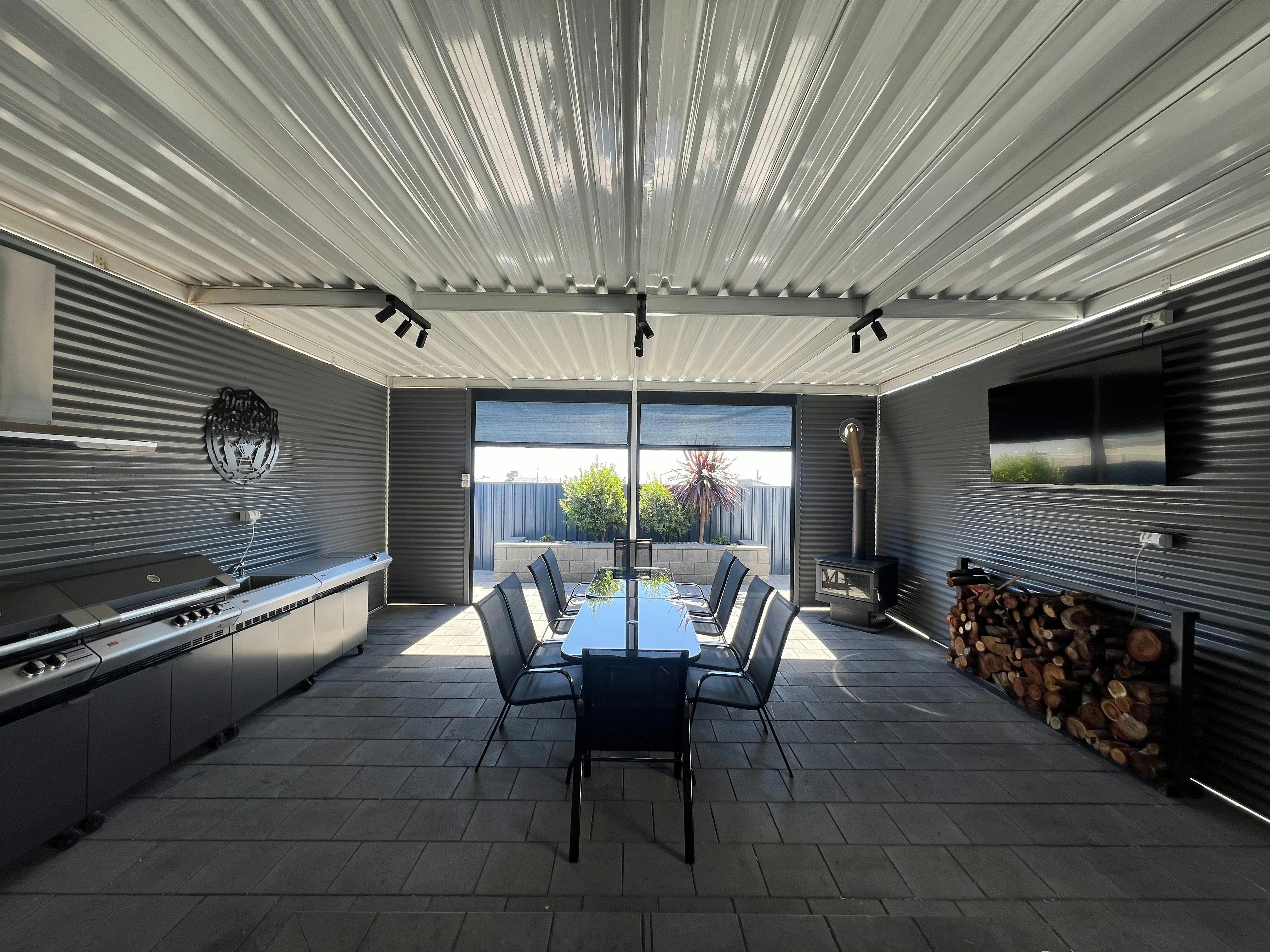 Expansive Outdoor Entertainment Area with Fireplace