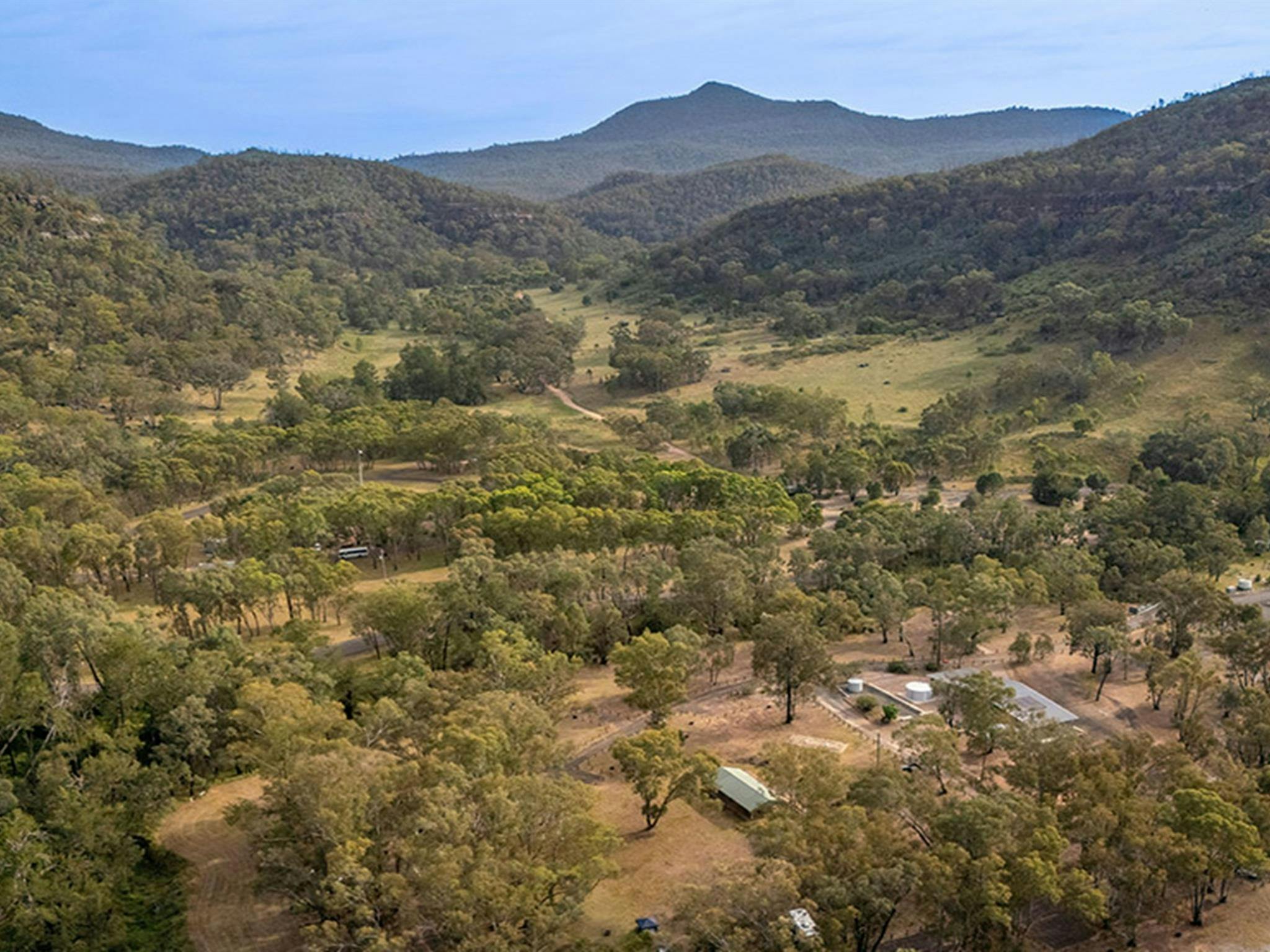 Aerial view of Camp Blackman with mountains in the background. Credit: John Spencer &copy; DCCEEW