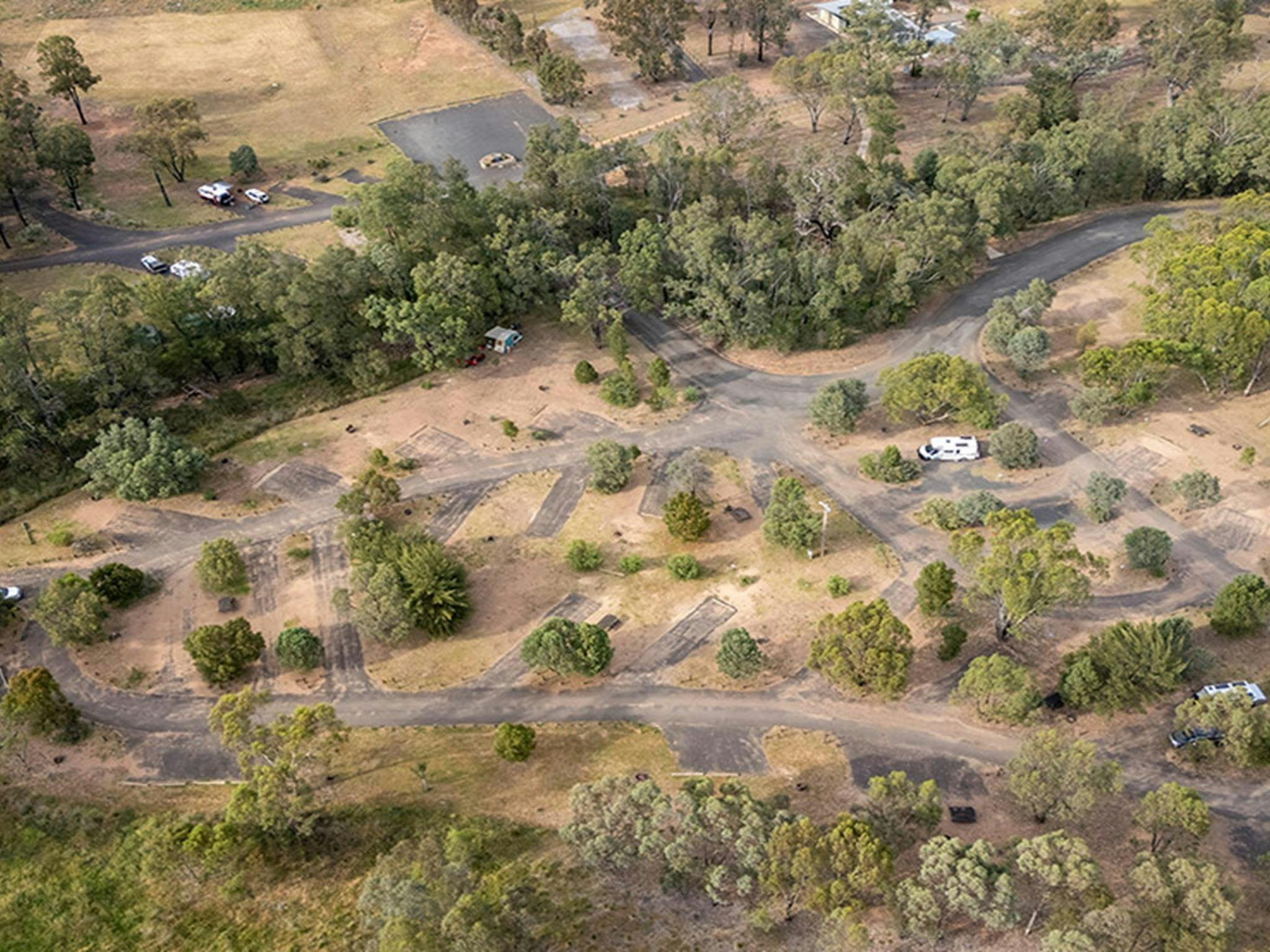Aerial view of campsites and the road at Camp Blackman. Credit: John Spencer &copy; DCCEEW