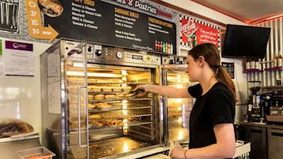 Waitress serves pies at the bakery