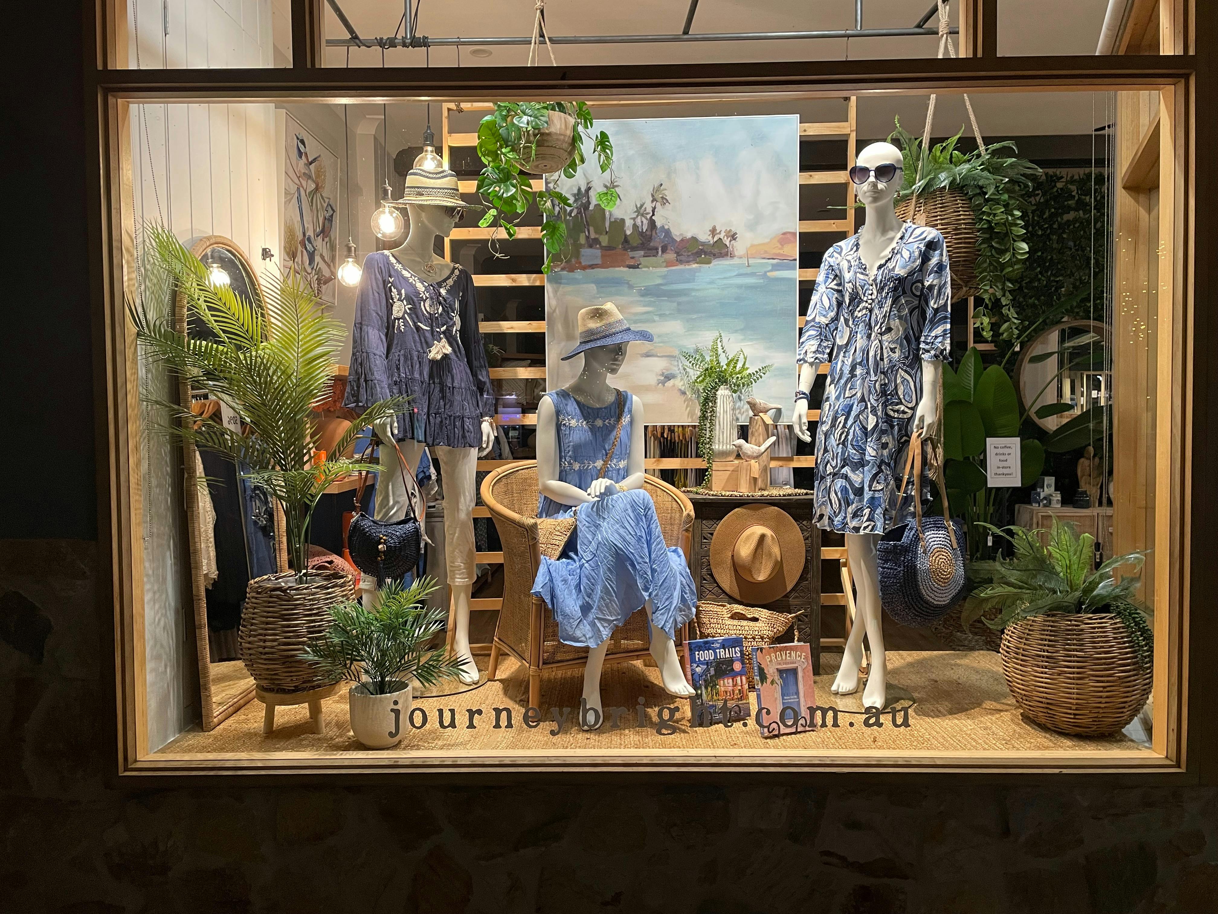 Front window outside Journey Bright with mannequins inside