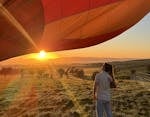 Hot air balloon at sunrise with  couple