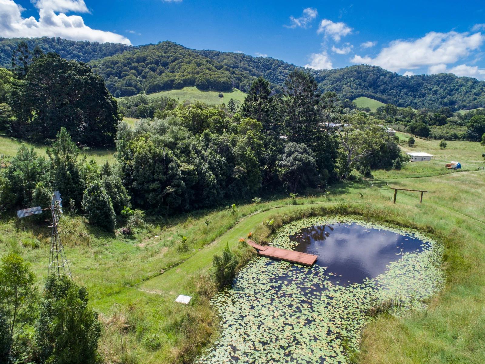 A beautiful farm property with a lake and pontoon
