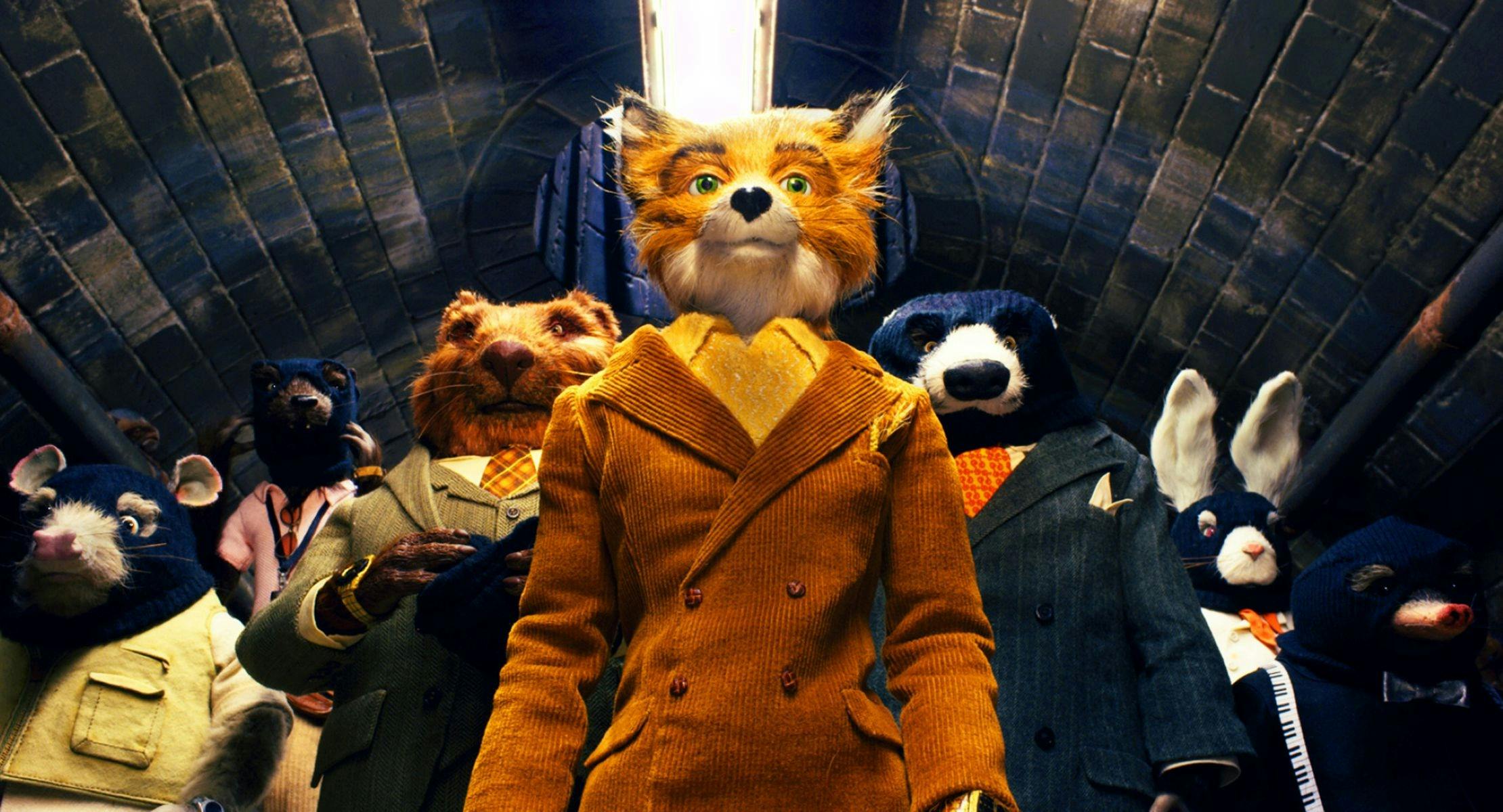 A fox, mole, badger and rabbit in suits walk through an underground tunnel