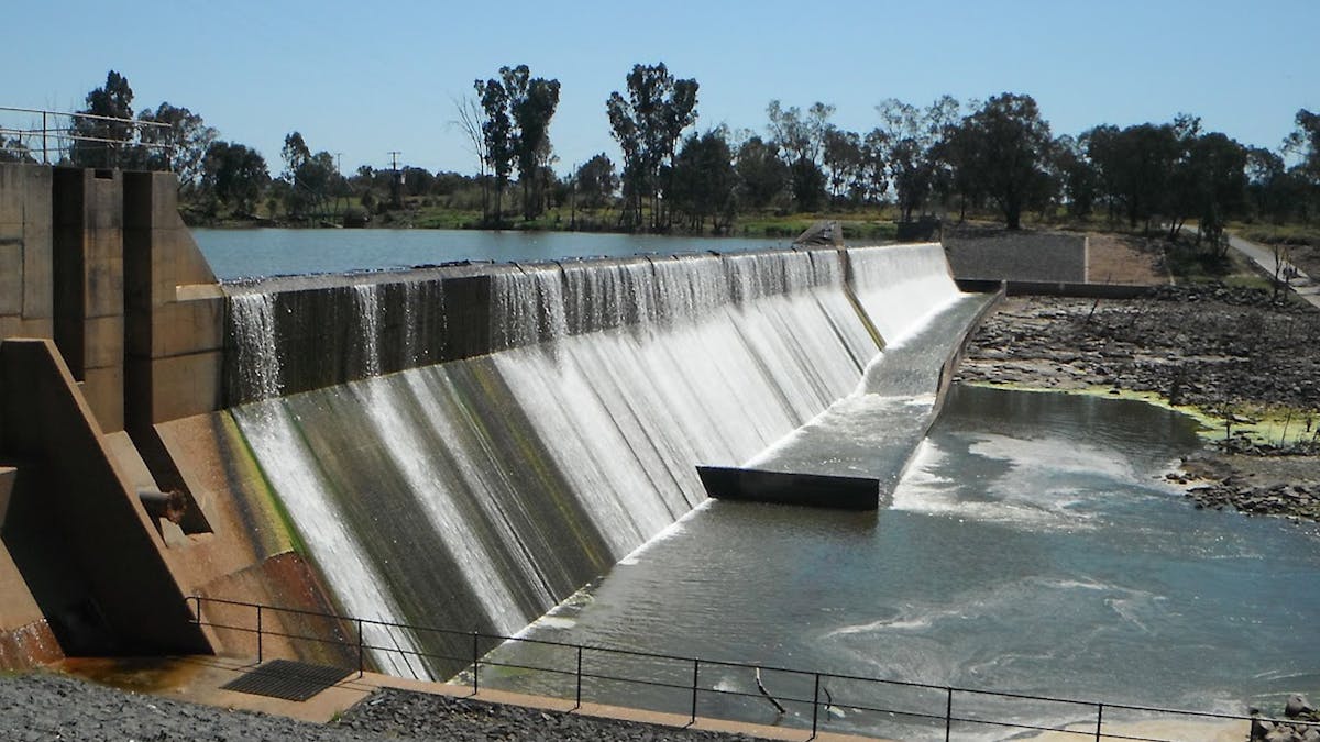 Water flowing over wall of Bedford Weir