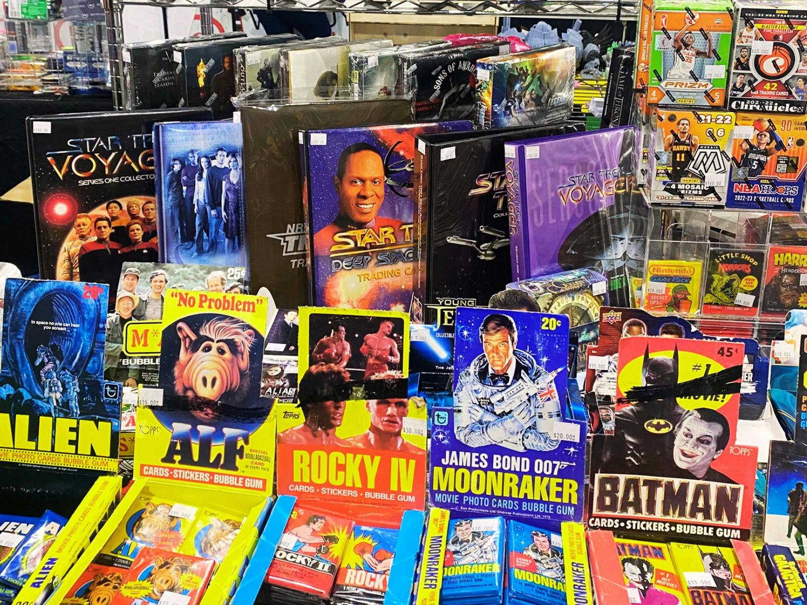 Vintage trading cards on display including movie and tv cards