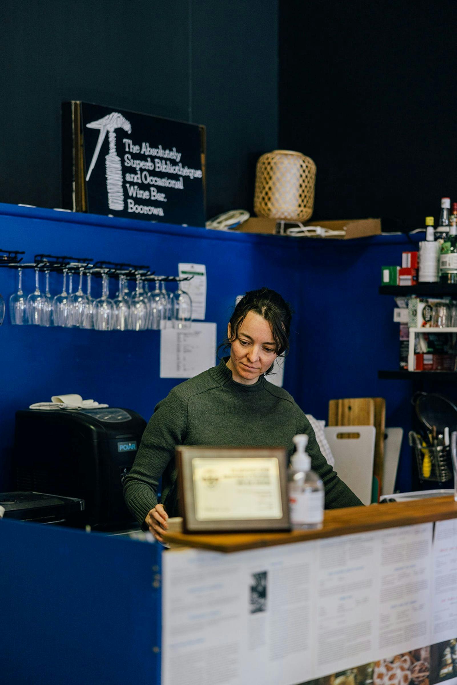 Female at counter of shop