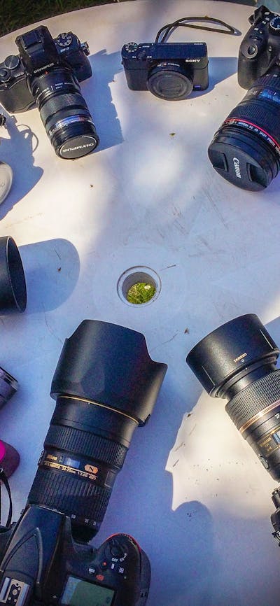 A range of digital cameras on a table