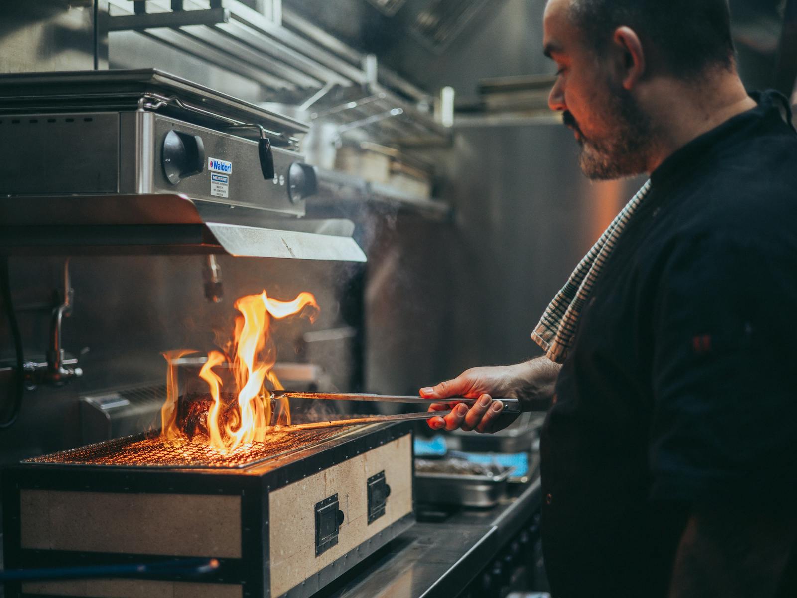 Our French Chef on the Hibachi Grill with flames