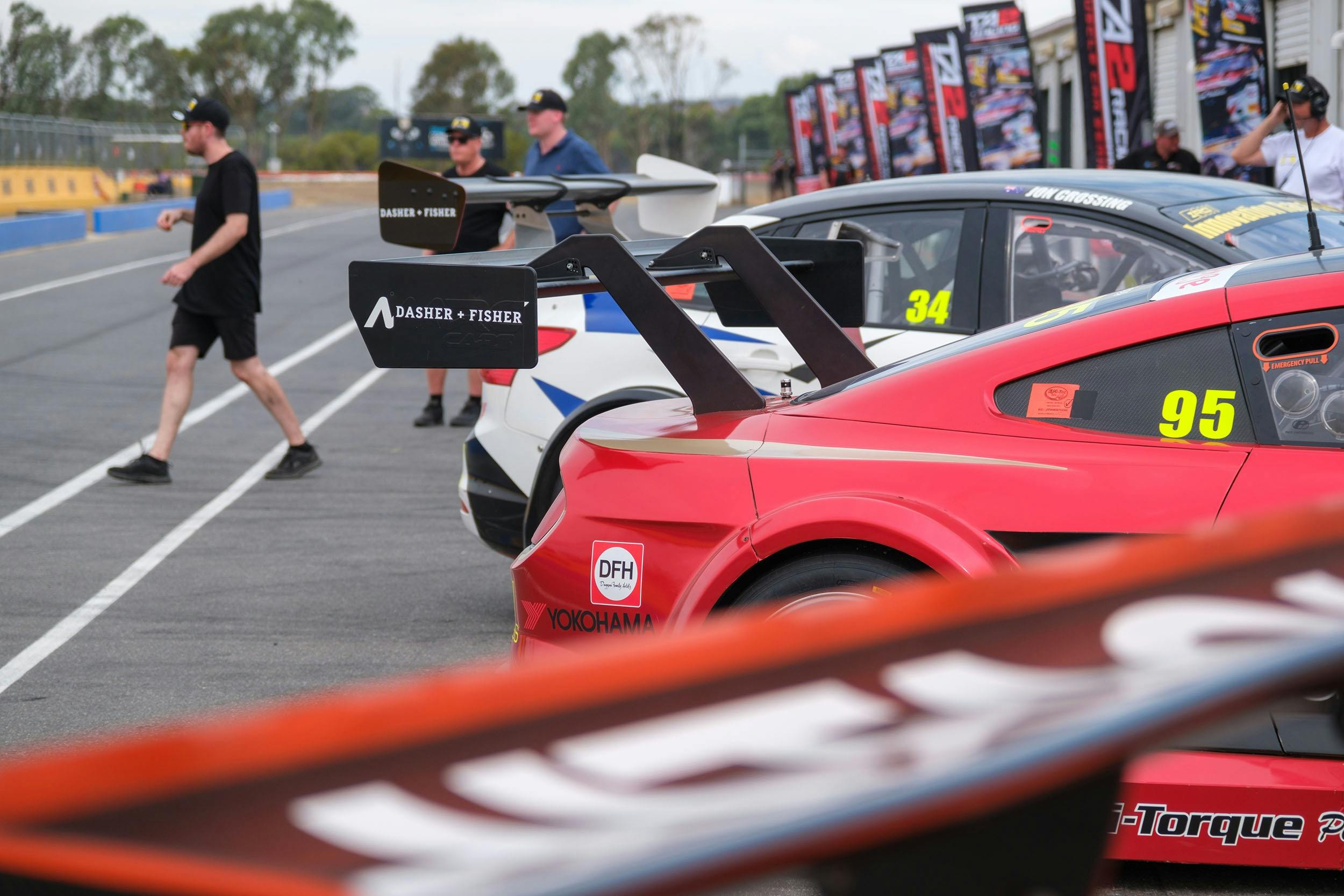 Racing cars in pit lane at Winton