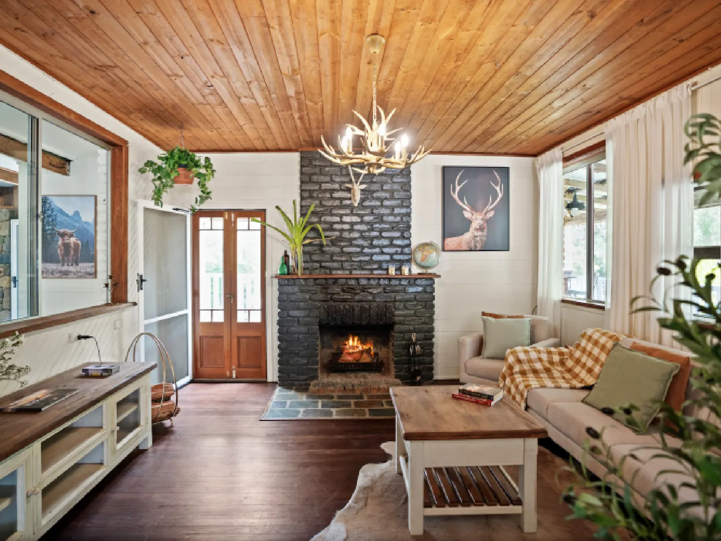 Living room with fireplace and balcony