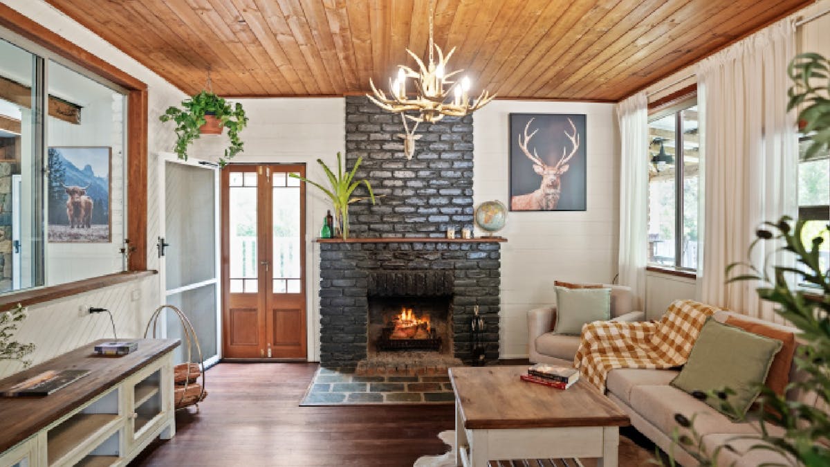 Living room with fireplace and balcony