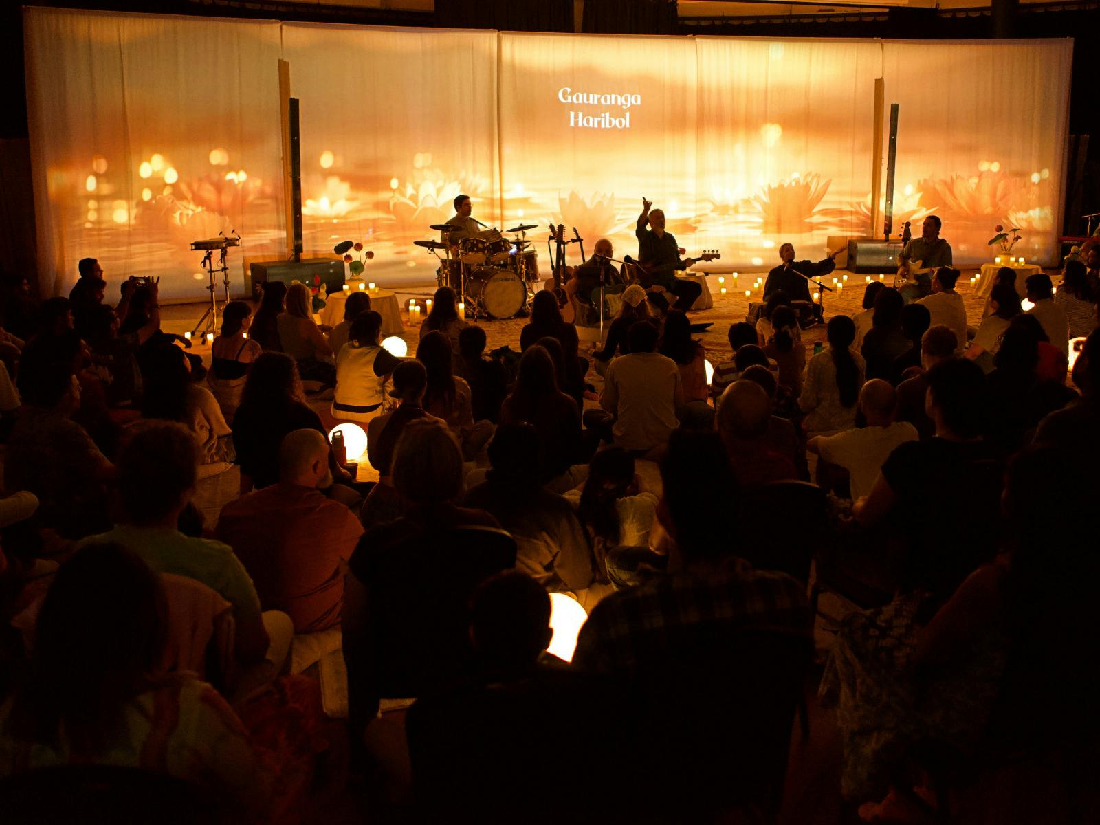 Group of people seated in a beautiful room singing