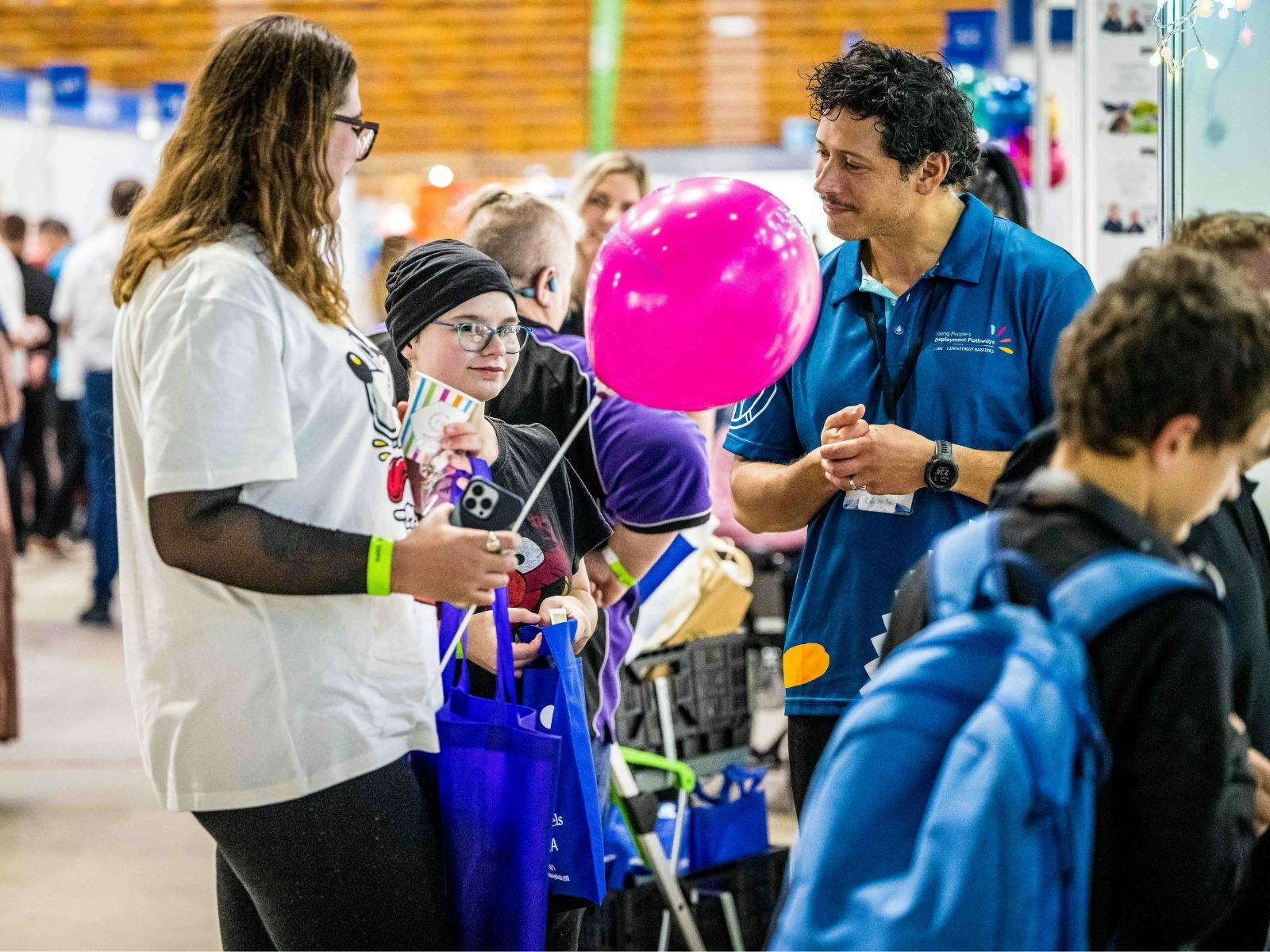 Attendees speaking with exhibitor at Hunter Disability Expo 2023