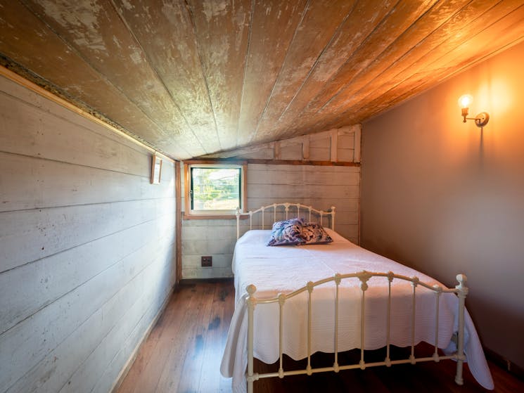 bedroom featuring queen bed and luxurious linen