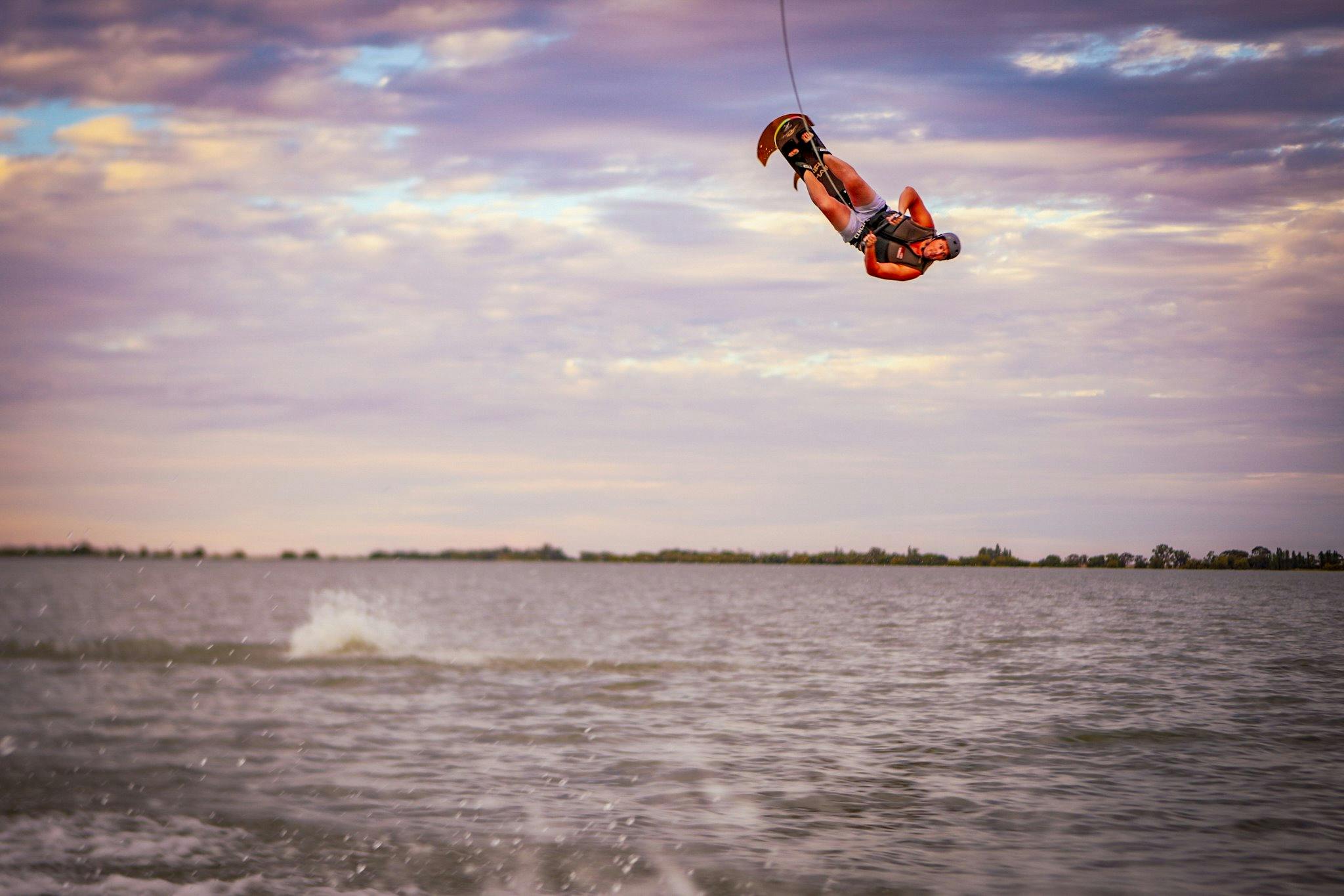 A man doing a high flip on a ski chair on Kangaroo Lake