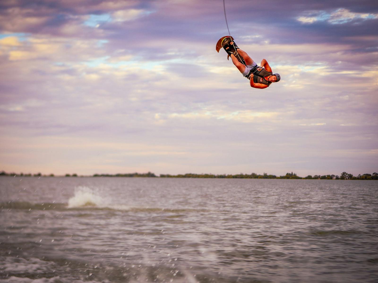 A man doing a high flip on a ski chair on Kangaroo Lake