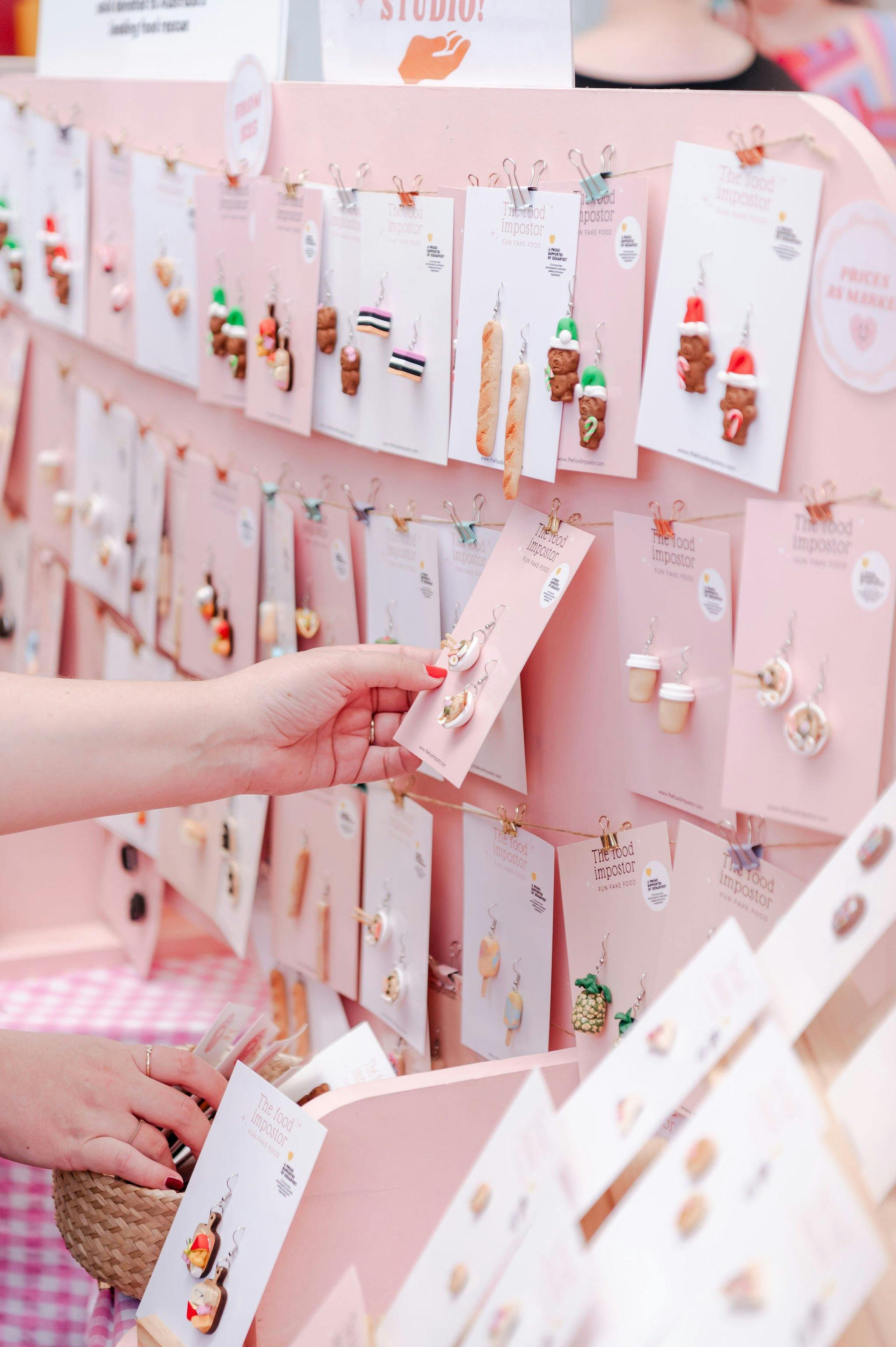 A customer browsing food-inspired earrings