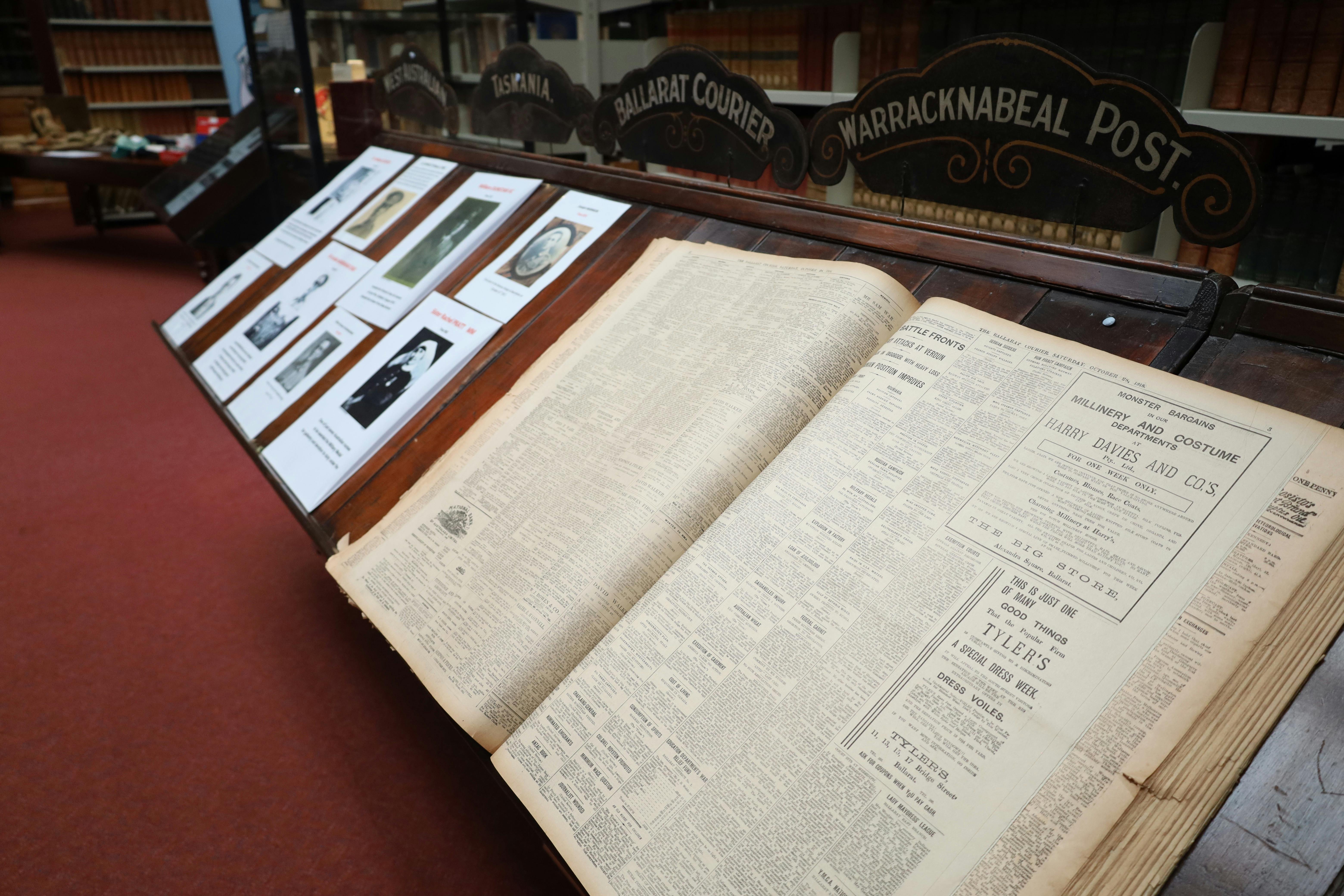Photo of an old newspaper sitting on a reading desk