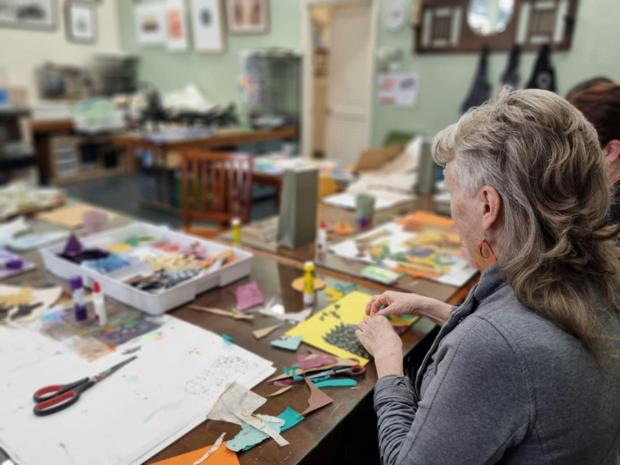 participants collaging in art studio
