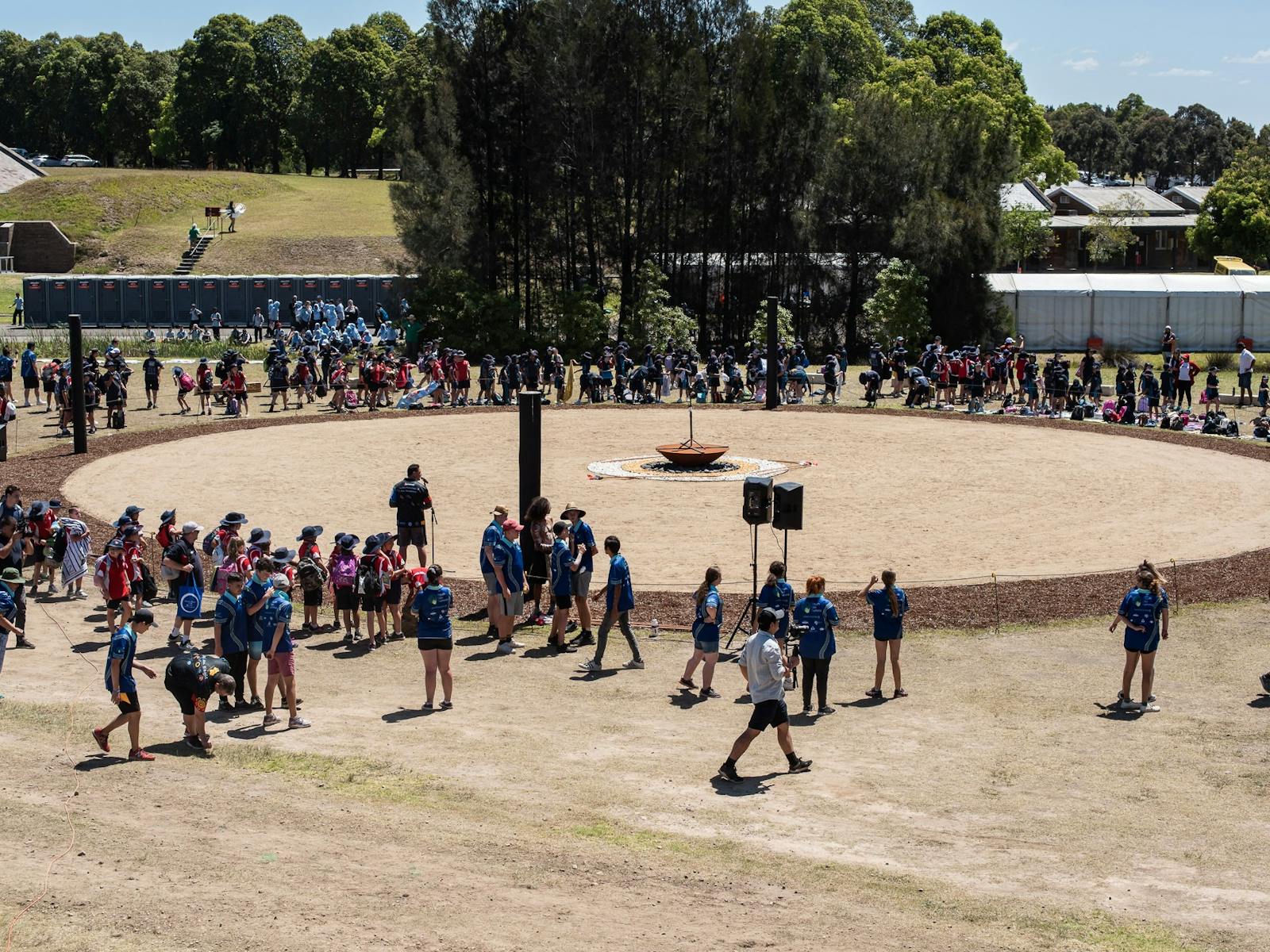 Birds eye view of a crowd of people surrounding the dance ground.
