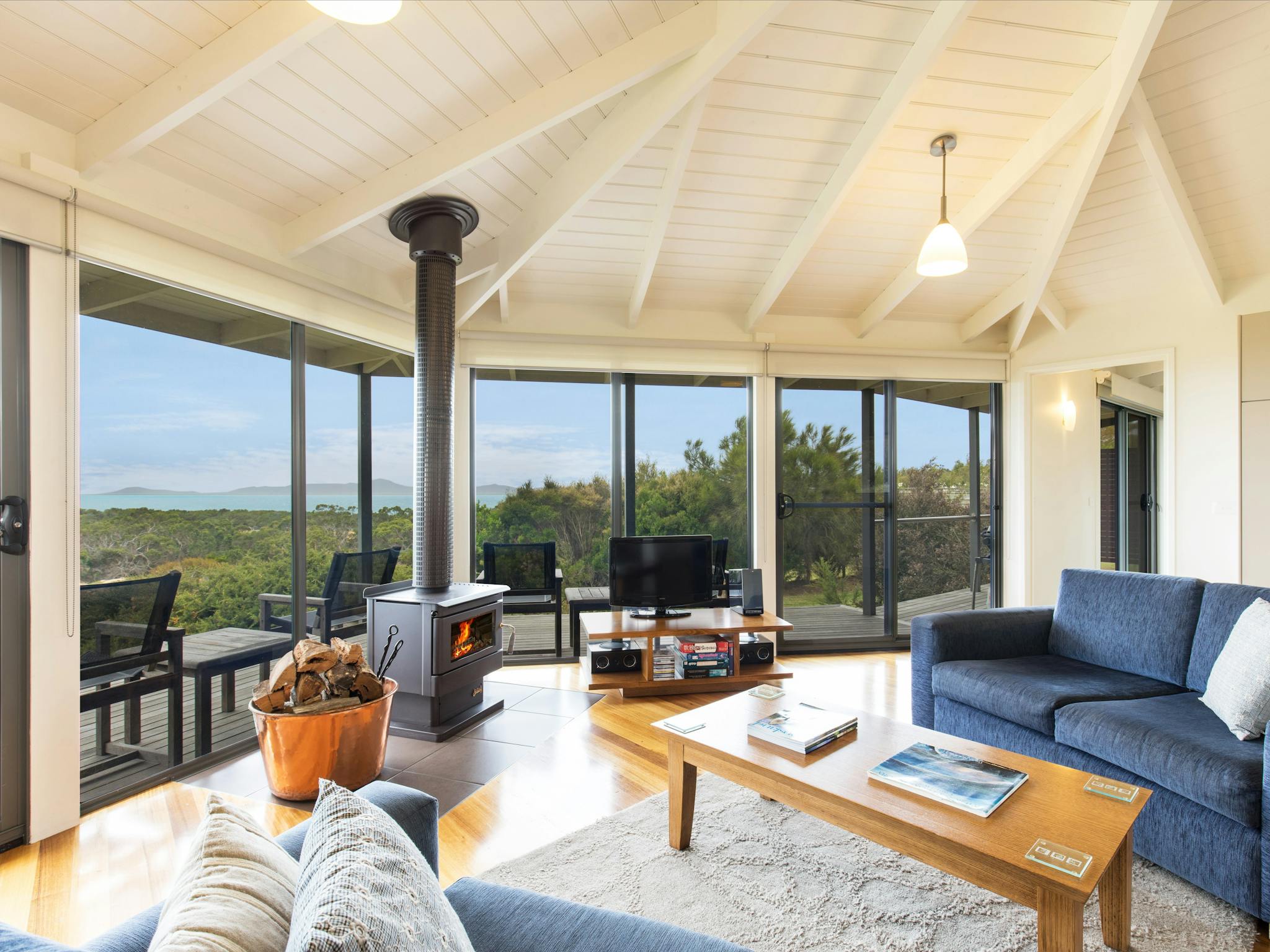 Lounge, woodfire and  view through window