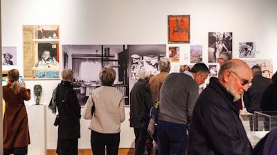 People exploring the Taglietti Exhibition