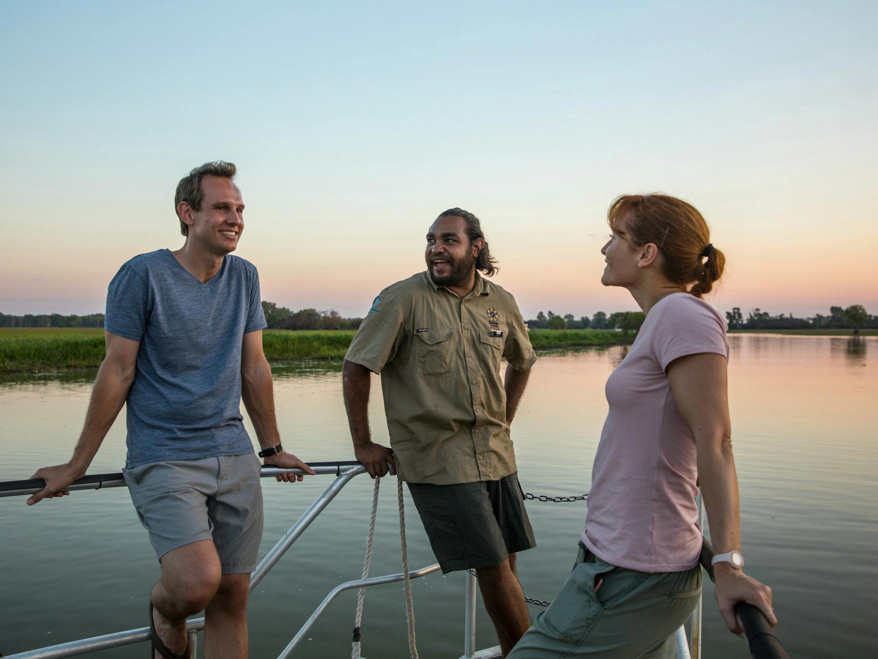 Visitors with a Aboriginal guide aboard a Yellow Water Billabong cruise.