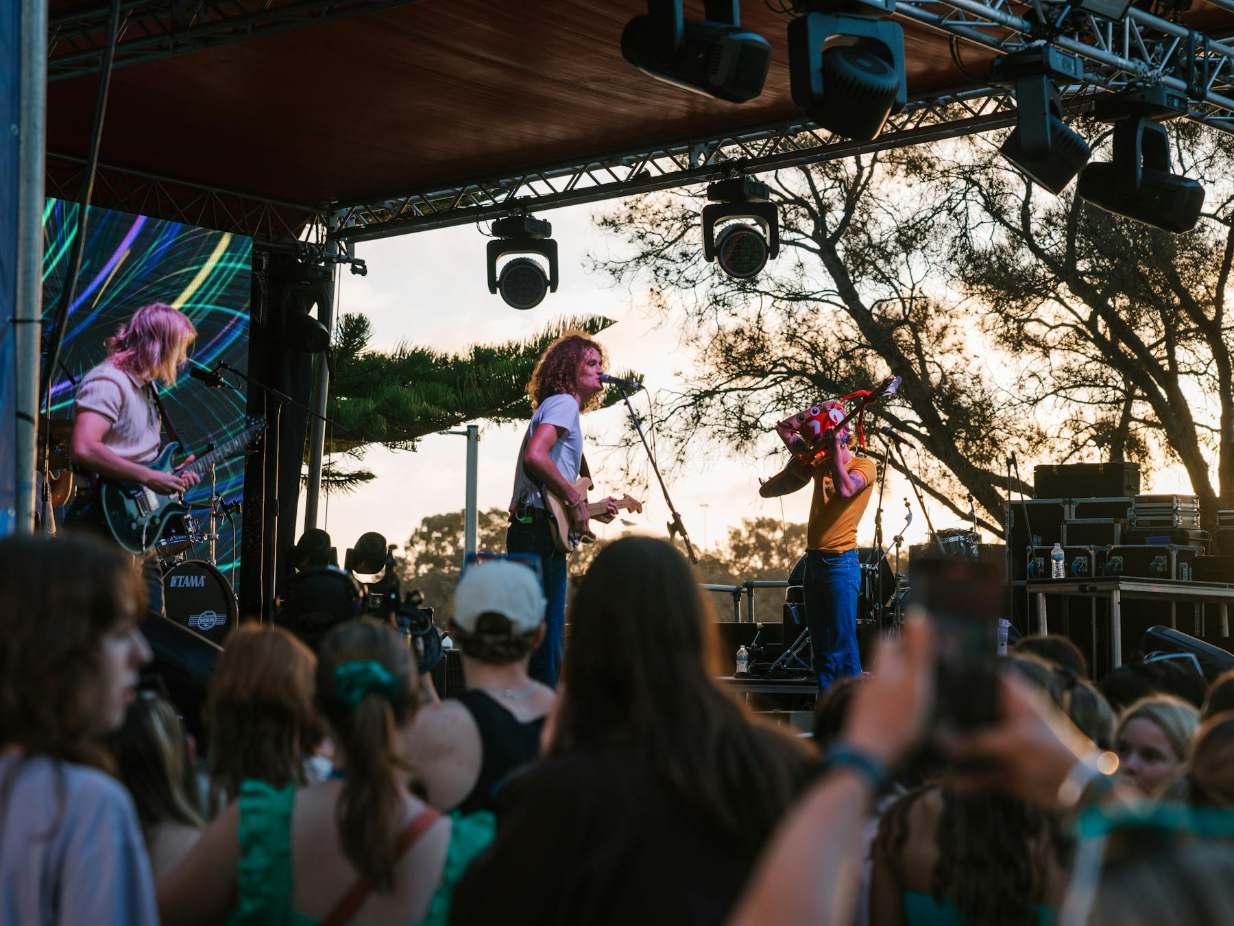 band on stage with large crowd