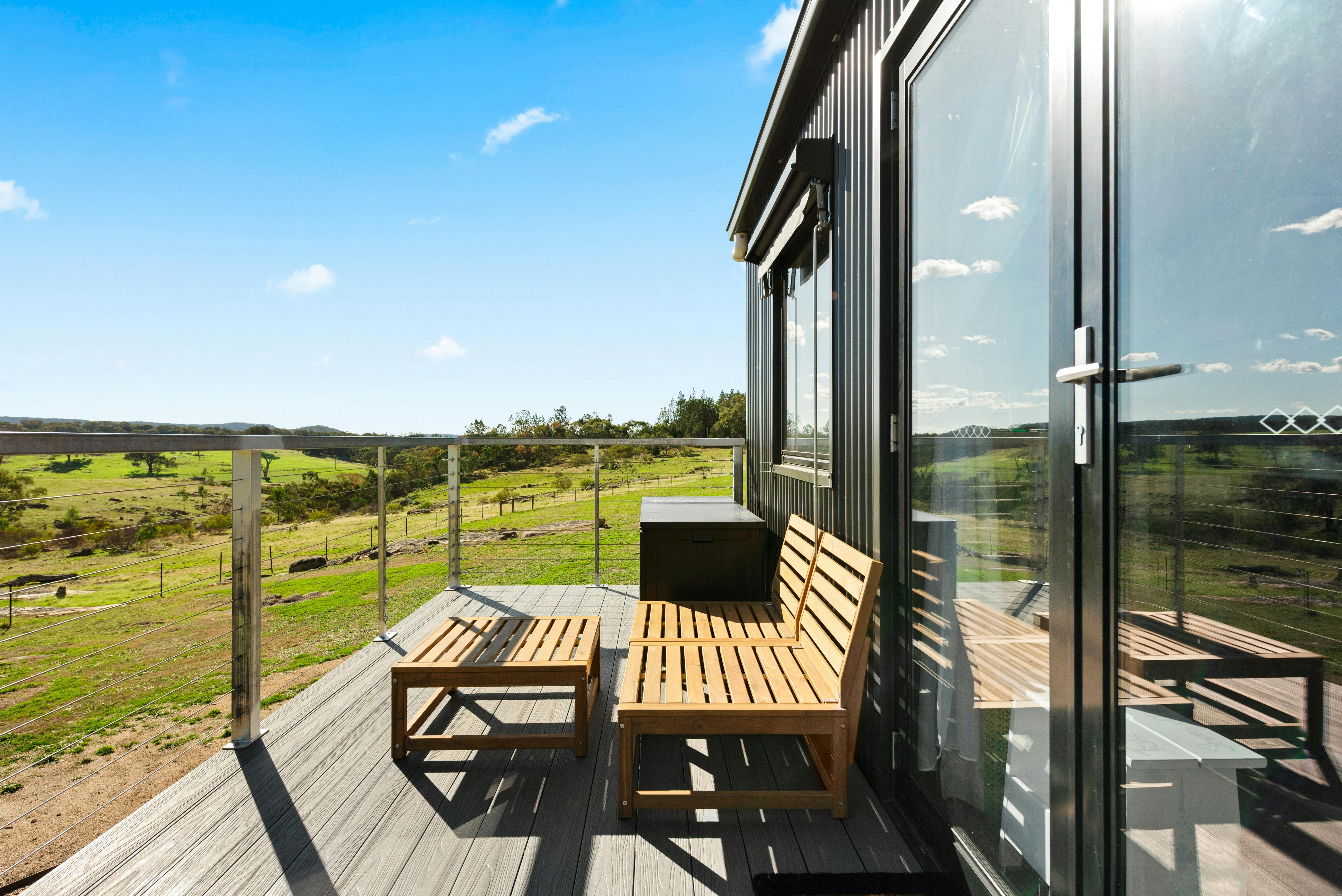 Outdoor decking area with seating and open air views