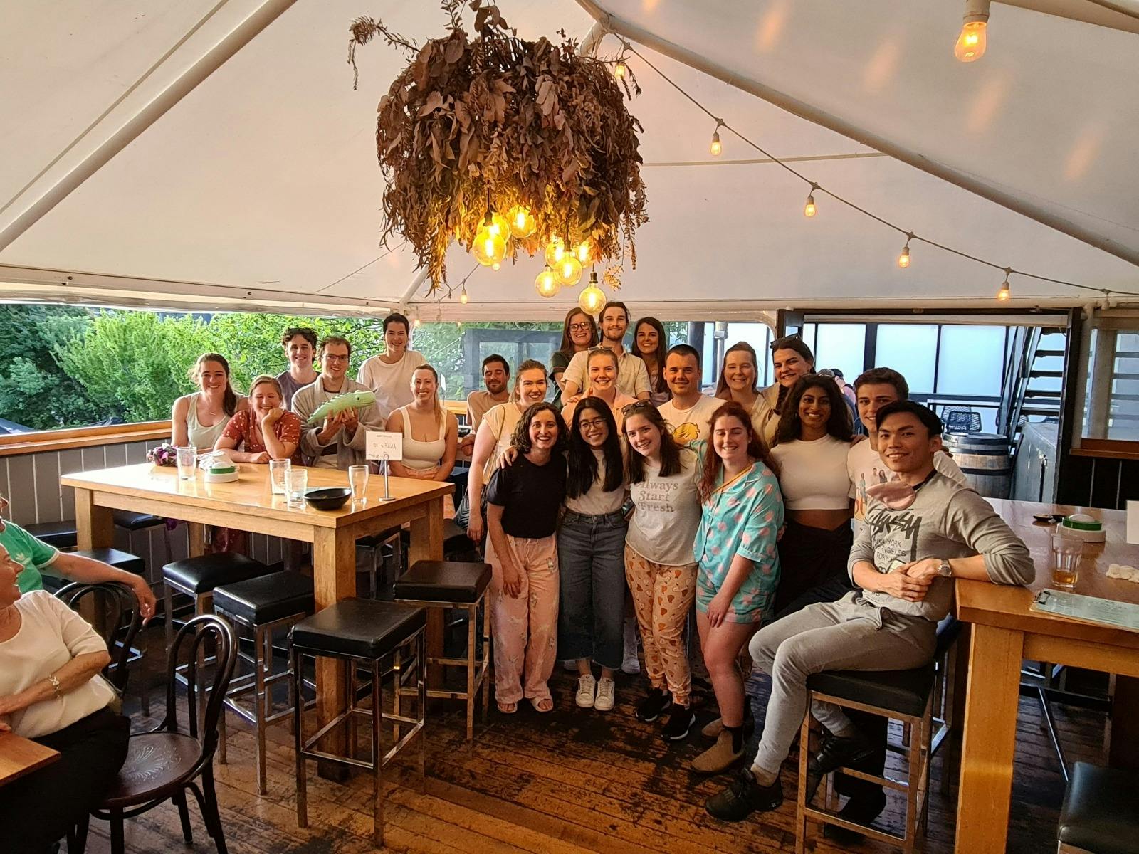 Group of winning team smiling after quiz.