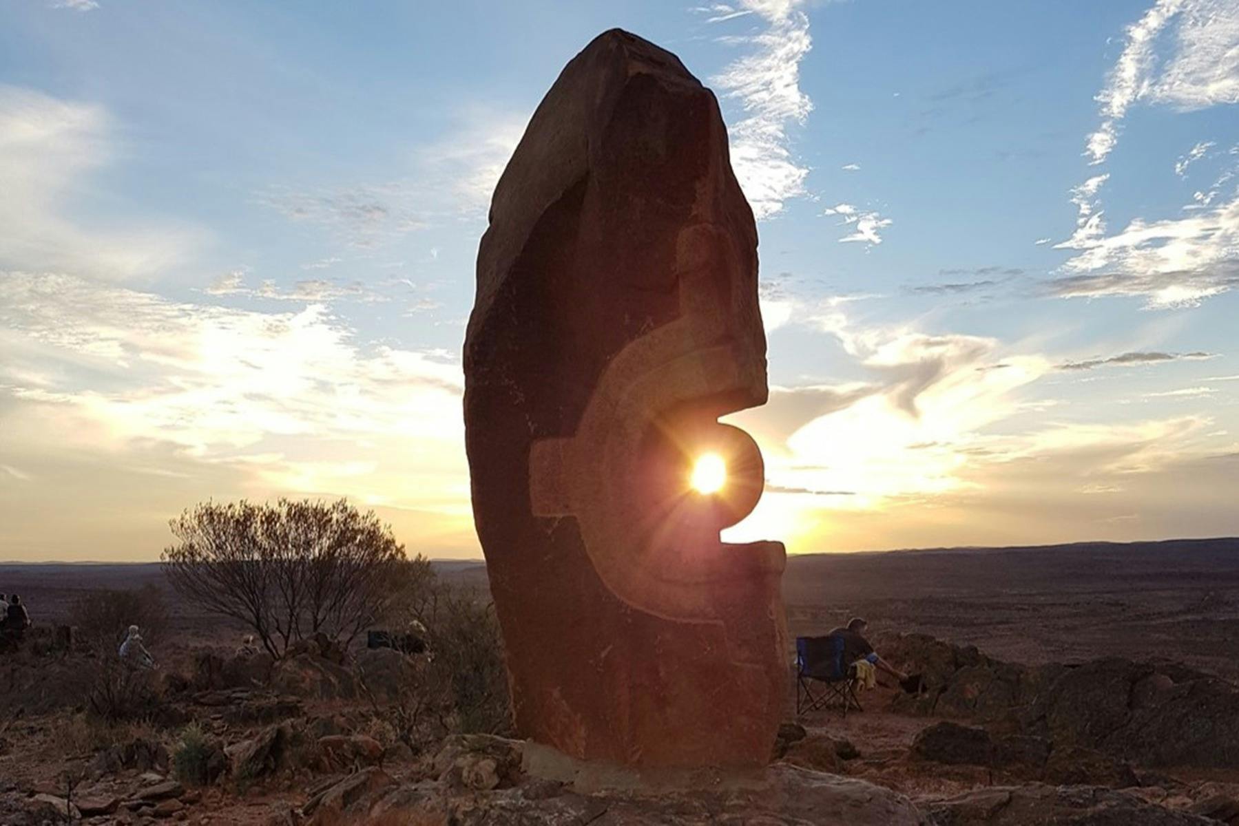 Sunset behind sculpture