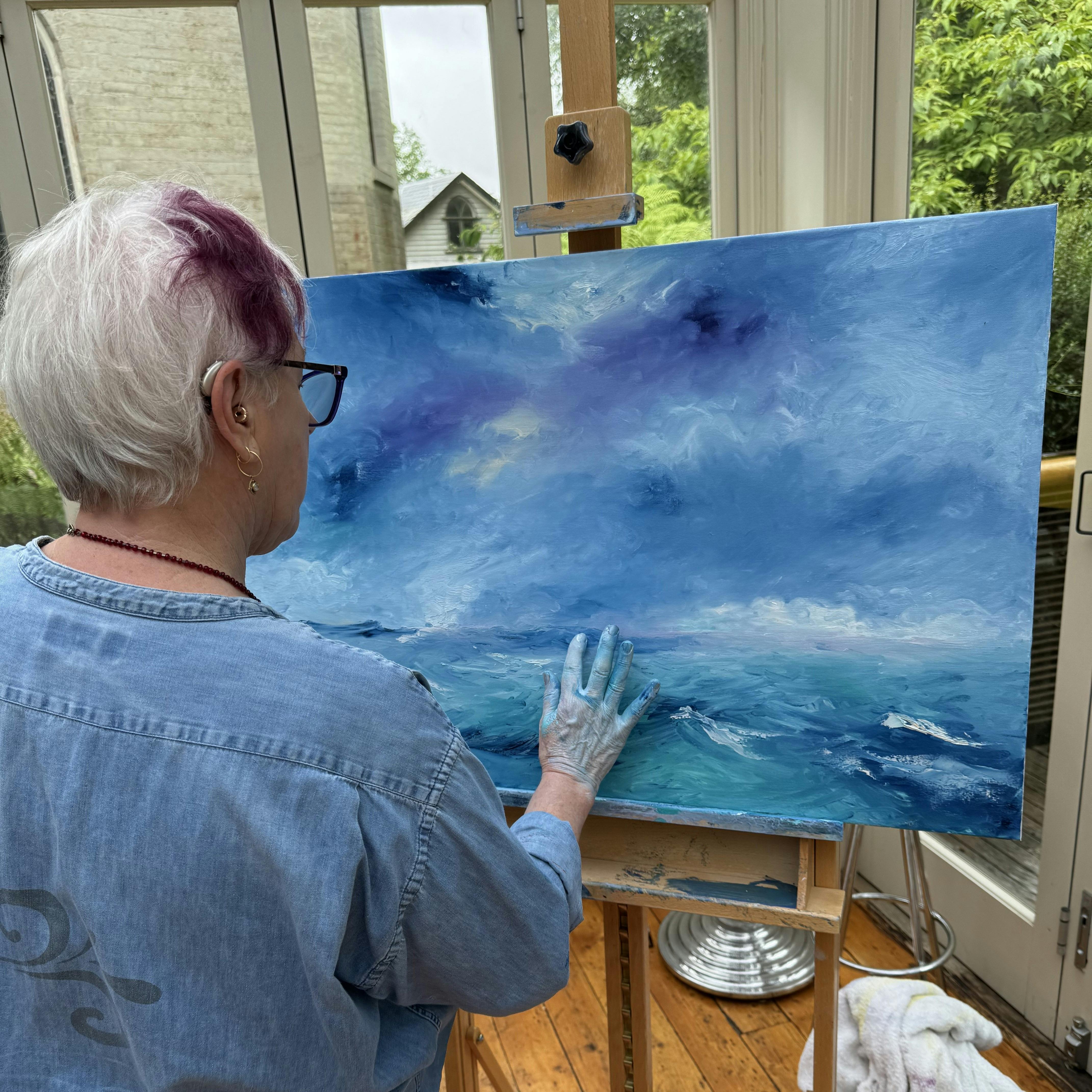 participant at painting clouds workshop