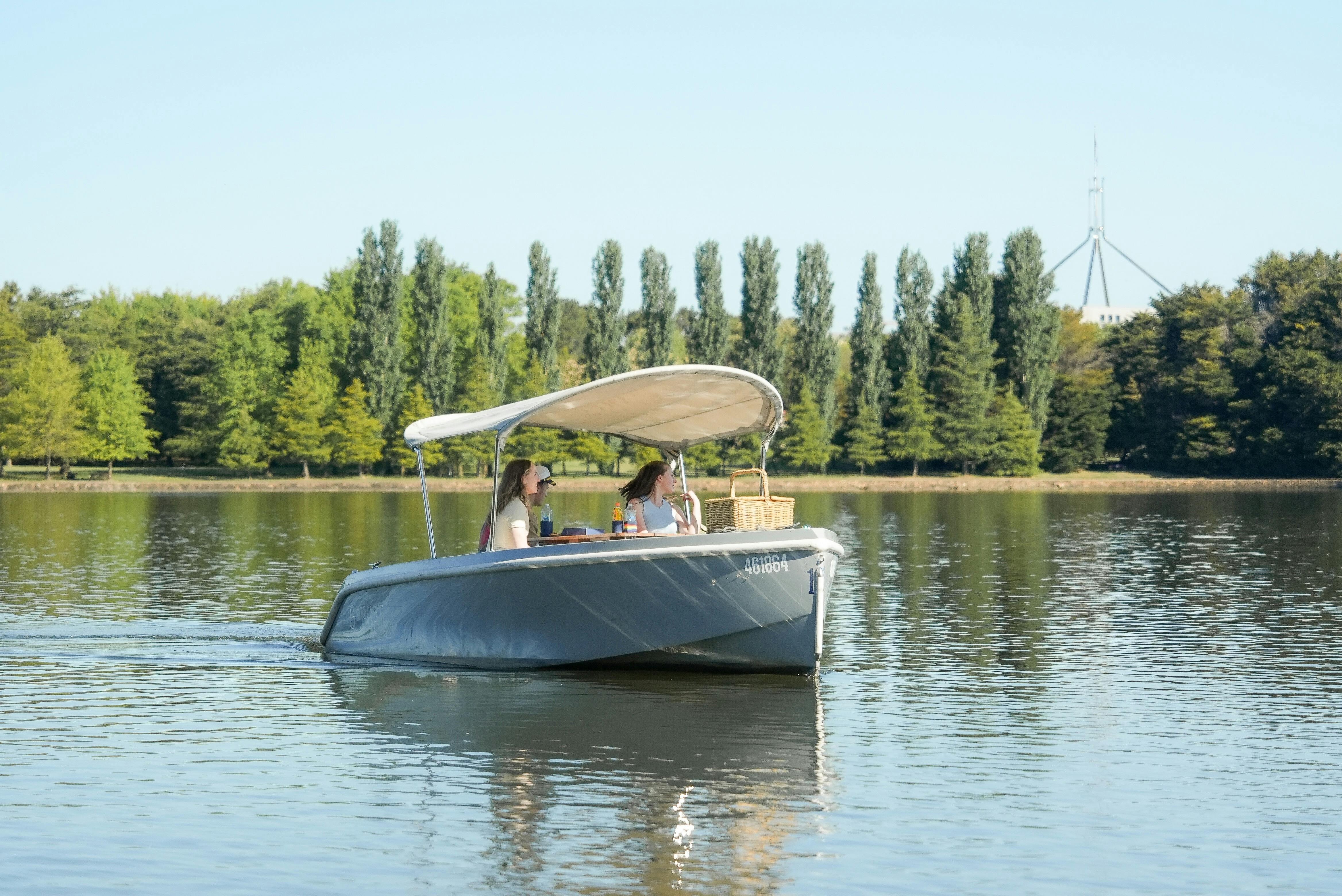 Group Enjoying a Picnic Aboard a Luxury Electric Boat on Lake Burley Griffin