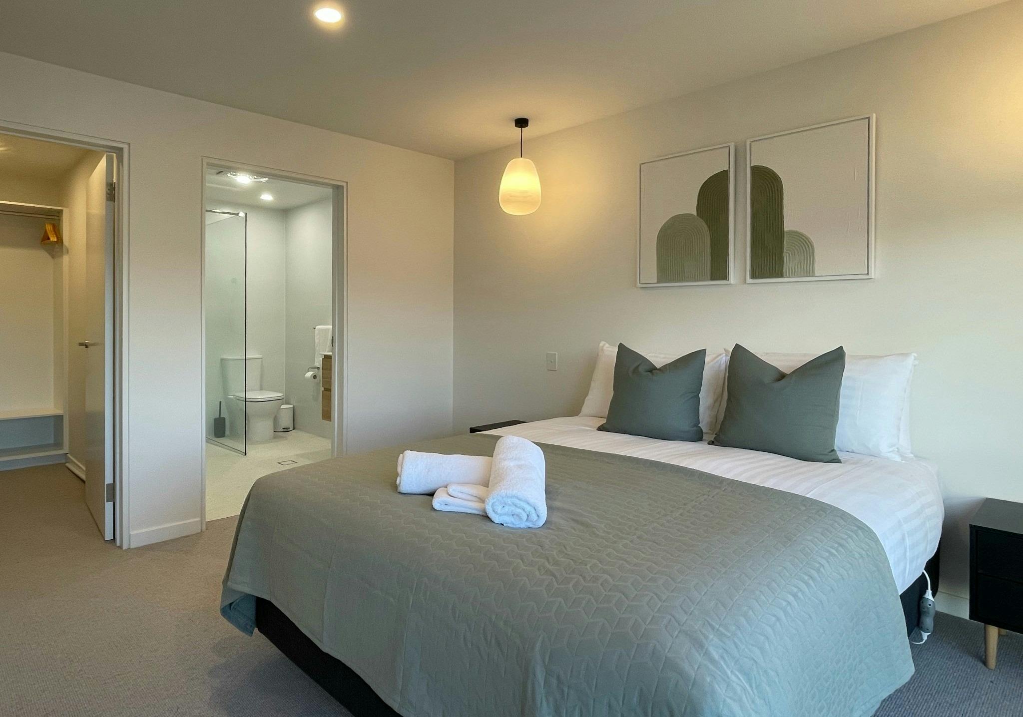 Bright and welcoming master suite featuring premium bedding, private ensuite access + ample storage