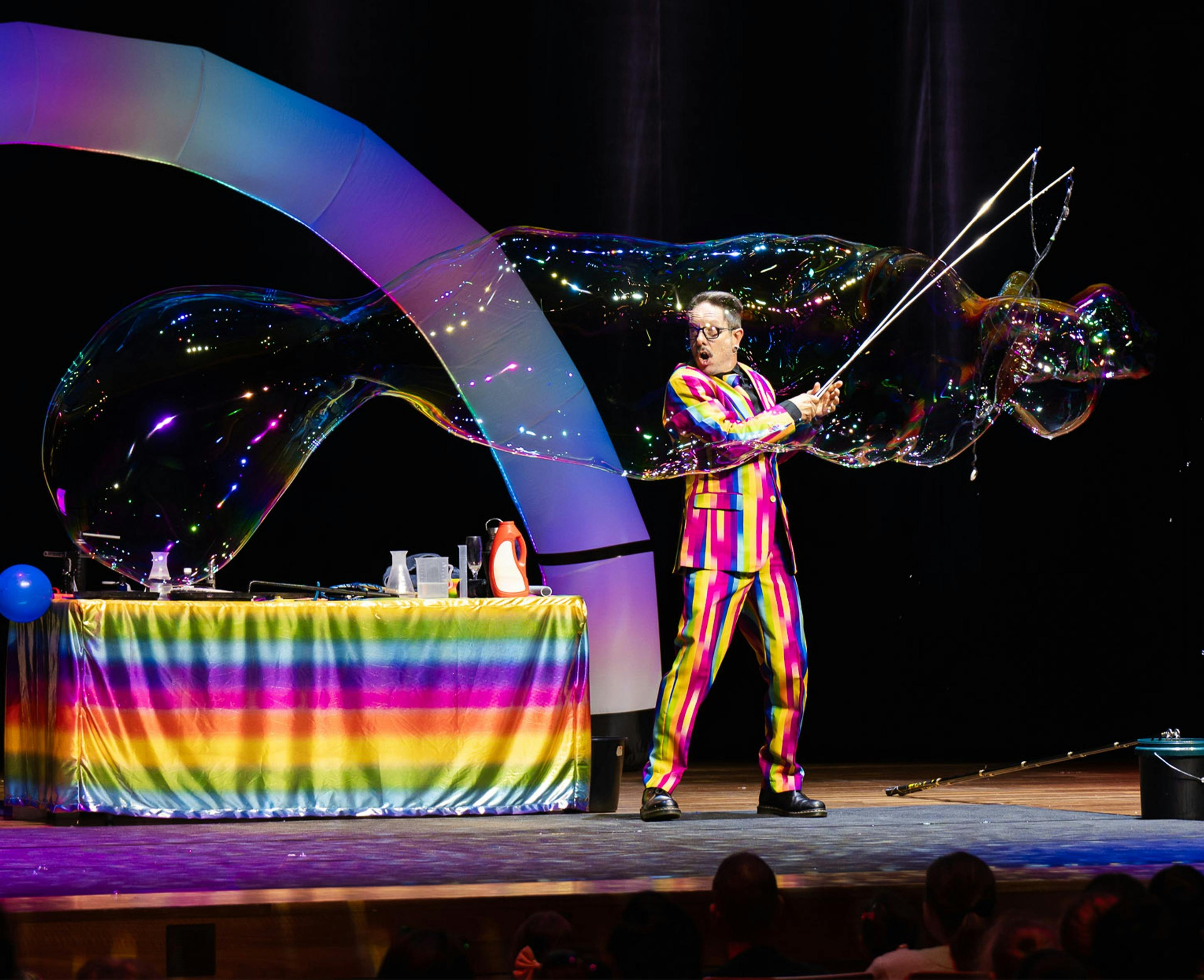 Dr Hubble making giant bubbles on stage