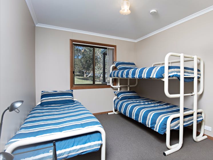 Bunk beds and single beds featured, fit for the whole family.