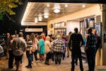 A crowd waiting outside the Montreal Community Theatre