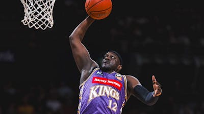 Sydney Kings player and opponent on court
