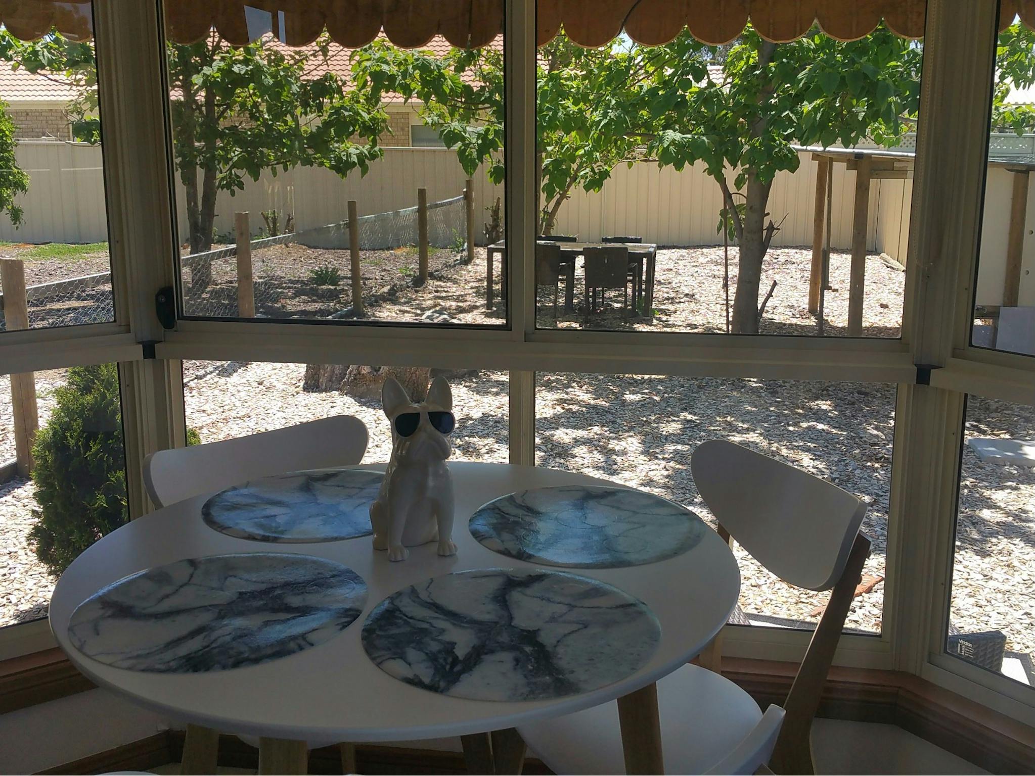 Self contained cottage dining area looking out over the secure garden