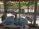 Self contained cottage dining area looking out over the secure garden
